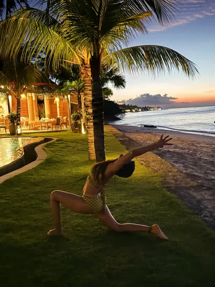 A quiet moment in a low lunge (Anjaneyasana) by the sea. This pose is wonderful for stretching the hip flexors, which get tight from sitting, and helps build strength and stability through the legs.