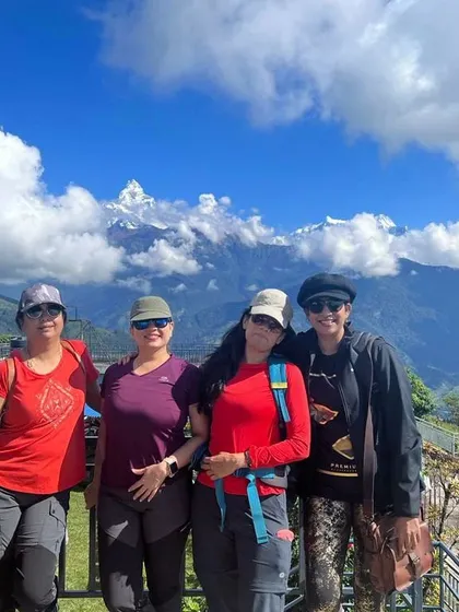 Our group of women trekkers, strong and smiling, with the Annapurna range behind us.