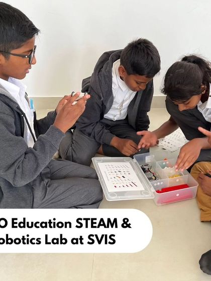 Students at Sadhu Vaswani International School (SVIS) work together on the floor, deeply engaged in a LEGO building challenge. Our programs are flexible and can be adapted to any classroom space.