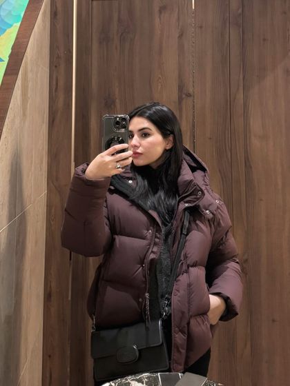 Another mirror selfie with the puffer jacket, this time with my face visible.