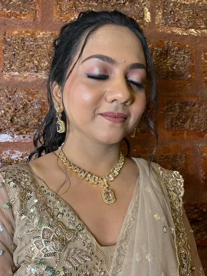 A close-up of the sangeet makeup, featuring a soft smokey eye and a neutral lip.
