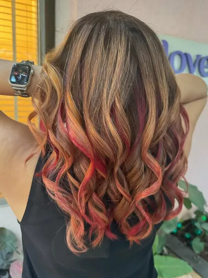 The back of the flaming red and copper hair, showing the full, fiery effect.