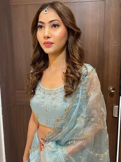 The client looks stunning and confident in her complete look, ready for her special event.