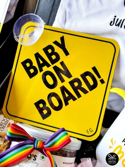 The bright yellow 'Baby on Board!' sign is a fun and practical addition to my pregnancy announcement hampers.