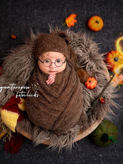 A wide shot of the Harry Potter theme, showing the complete setup with a fur-lined basket, pumpkins, and a Gryffindor scarf creating a cozy, magical atmosphere.