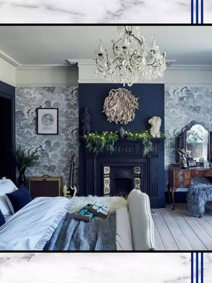 This inspiration image shows a bedroom with a classic, cozy feel, featuring a fireplace, ornate chandelier, and beautiful wallpaper. We can create similar custom designs for you.