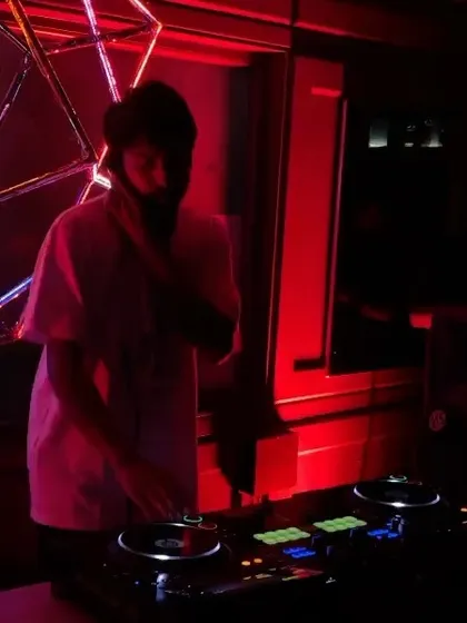 A shot of me at the decks during the 'Back 2 Skool Jam'. The red lighting and intimate setting were perfect for a night of classic hip hop and R&B.