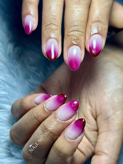 A beautiful wine-colored ombre with glittery tips. The almond shape and glossy finish make this a simple yet very elegant design.