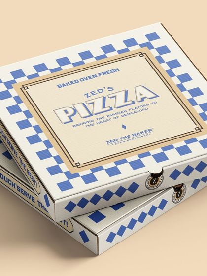 Another look at our custom-designed pizza boxes, which reflect the blend of Parisian flavors and Bangalore's palette that defines my brand.