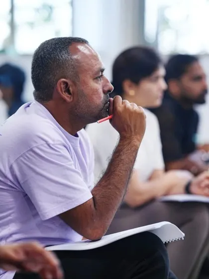 Concentration and focus are key. A close up of a student deeply engaged in the theoretical component of the EMS certification course.