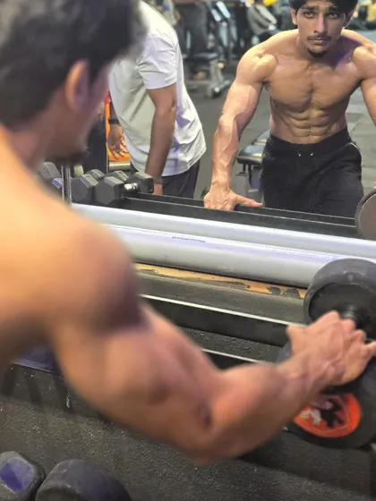 A moment of focus in the gym. My life revolves around a simple cycle: eat, sleep, workout, Taekwondo, and coffee. This discipline is what I share with my students.