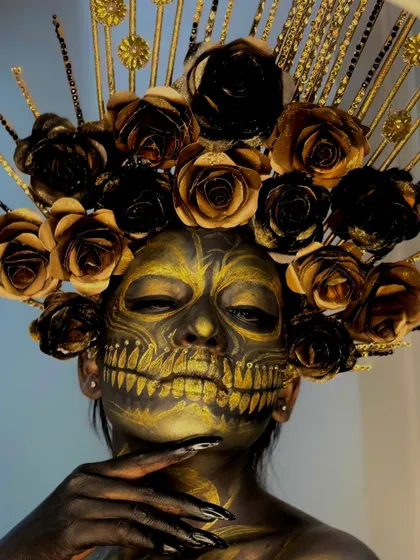 Another angle of the golden skull look, showing the elaborate headpiece. Our students learn to create and incorporate props and accessories into their makeup designs.