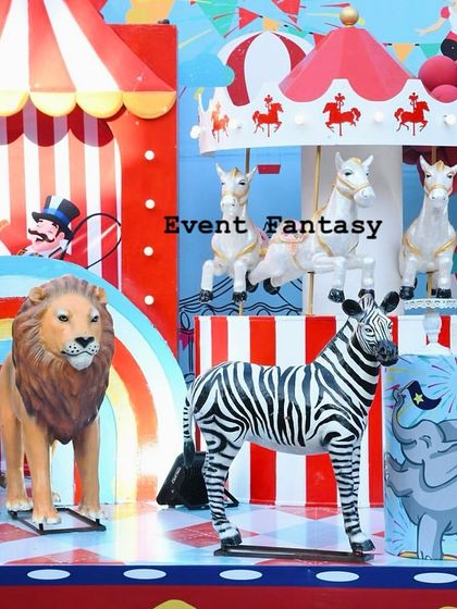 Another detailed shot of the carnival stage, with a lion, zebra, and carousel horses creating a lively circus scene.