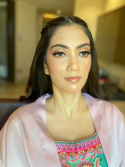 A before-and-after glimpse, showing the transformation with just the makeup base on.