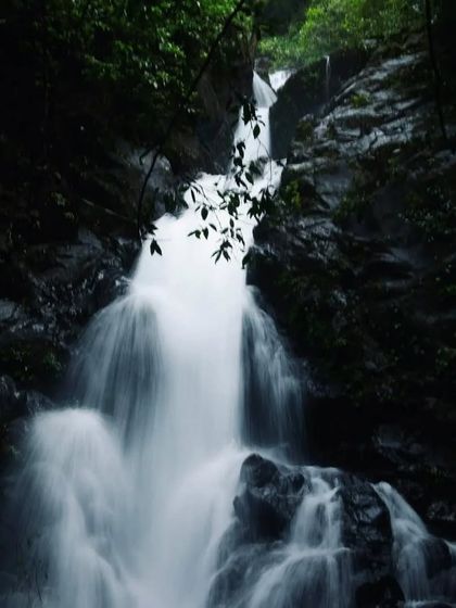 A long-exposure shot capturing the silky smooth flow of an offbeat waterfall in Honnavara, a perfect spot for photography enthusiasts.