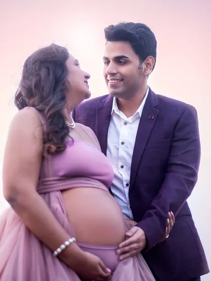 A close-up shot that highlights the emotion and intimacy between the couple, with the soft sunset glow in the background.
