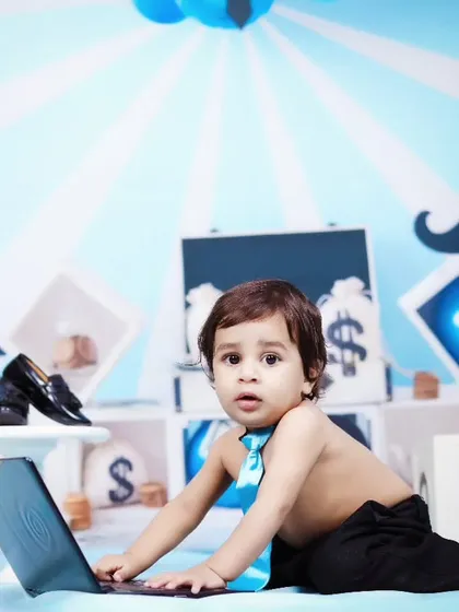 A curious 'Boss Baby' playing with a laptop in our fun office-themed set.