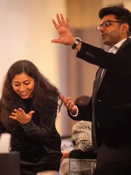 A guest reacts with delight during an interactive part of my stage show. Getting the audience involved is key to creating a dynamic and memorable corporate event.