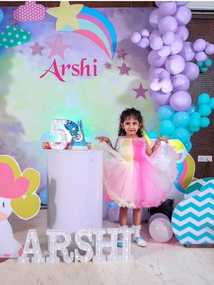 A magical 'Princess' themed birthday party, with elegant decor, shimmering backdrops, and royal props, making every little girl feel like royalty.