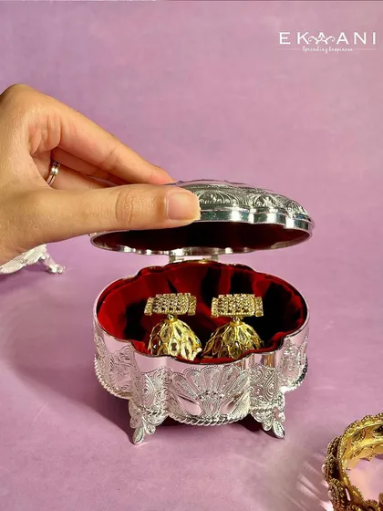 Because one jewellery box is never enough. This charming, scalloped silver-plated box is perfect for storing your favorite jhumkas or other small treasures in style.
