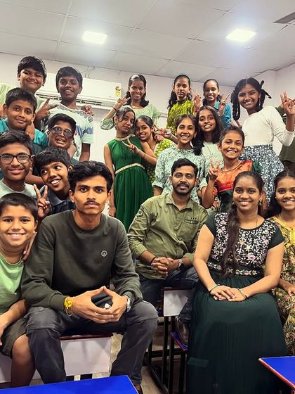 A large group photo from our Green-themed celebration, with students and teachers together.