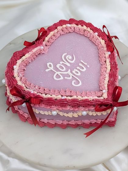 Another angle of the romantic vintage heart cake, a popular choice for anniversaries and Valentine's Day celebrations.