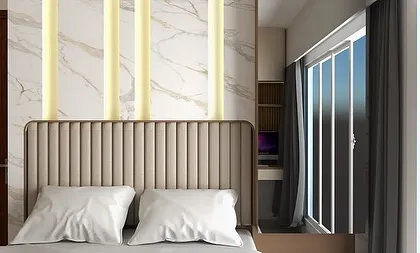 A close-up of a master bedroom headboard design. We used vertical upholstered panels against a marble-finish back with inlaid profile lights for a touch of hotel-like luxury.