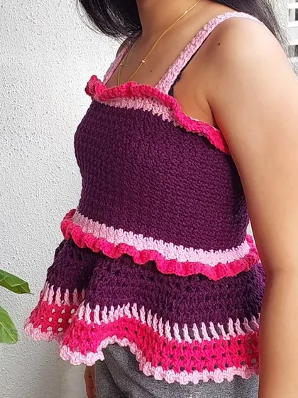 The side profile of the Azores Top shows off the two-tiered peplum ruffles. This design is incredibly flattering and can be customized in length.