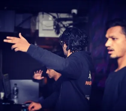 Another angle of me in action, focused on the mix and the crowd's reaction. Every detail matters.