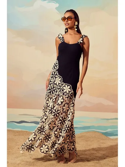 A full-length shot of the Floral Crochet Knit Dress by Qala Clothing, showcasing the beautiful contrast and craftsmanship of the piece.