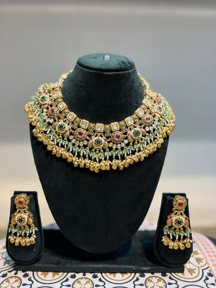 Our semi-bridal heritage jewellery set, displayed and ready for you. The rich colours and detailed work make it a standout piece for any wedding function.