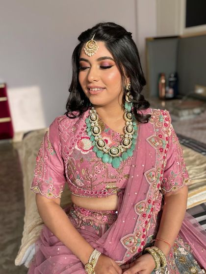 A close-up of Saumya's sun-kissed makeup. The pink smokey eye and glowing cheeks give her a fresh and youthful look.