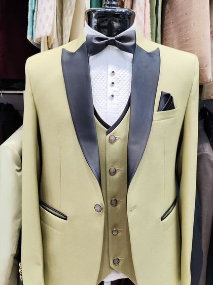 A collection of our designer suits, showcasing a variety of colors, fabrics, and custom details like embroidery, unique lapels, and accessories. Each piece is crafted to make a lasting impression.