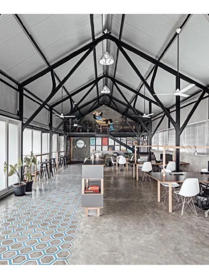 This is my own design studio, a space I created to be open, collaborative, and inspiring. The industrial warehouse structure is balanced with patterned floor tiles and plants, reflecting my philosophy of blending raw forms with thoughtful details.