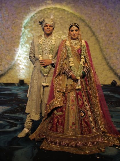 The official portrait of the stunning couple. Her royal Marwar Couture lehenga and his elegant Ankit V Kapoor sherwani come together to create a timeless and majestic wedding look.