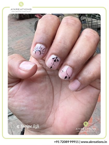 This view shows how our minimalist designs look in natural light, with delicate black line art that stands out against the clean, natural nail.