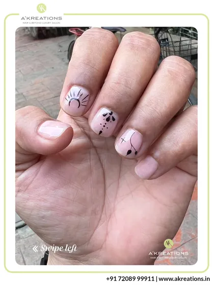 This view shows how our minimalist designs look in natural light, with delicate black line art that stands out against the clean, natural nail.