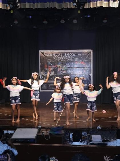 A synchronized dance move from our junior batch, showcasing their coordination and teamwork.