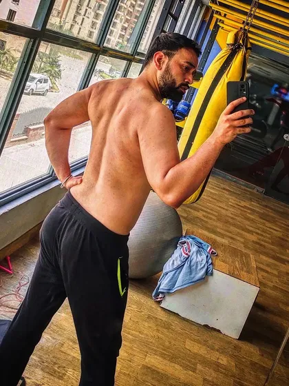 A mirror selfie showing my back development. A strong back not only looks good but is essential for supporting almost every other lift you do.