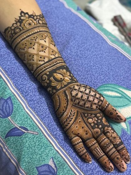 The full arm view of the design, showing how the patterns flow from the palm to the elbow.