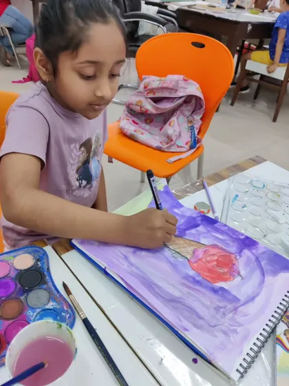More images of our dedicated young artists at work and proudly displaying their creations.
