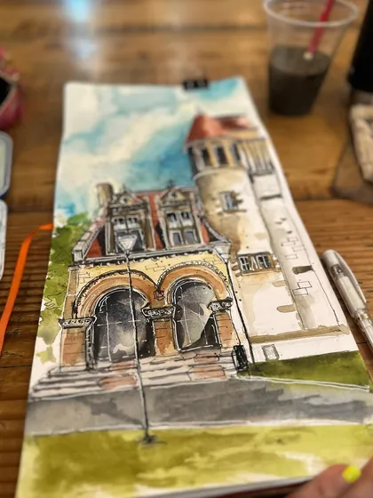 The completed sketch of the Cambridge Public Library in my open sketchbook, ready to be shared.