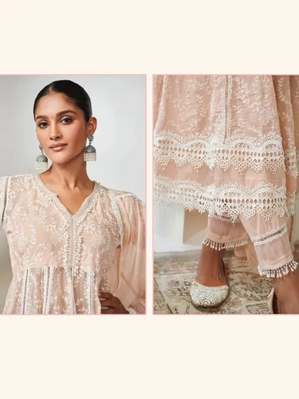 A detailed shot of the Twyla Organza Beige Kurta Set, as seen on Khushi Kapoor. Notice the delicate lace trim on the hem and sleeves.
