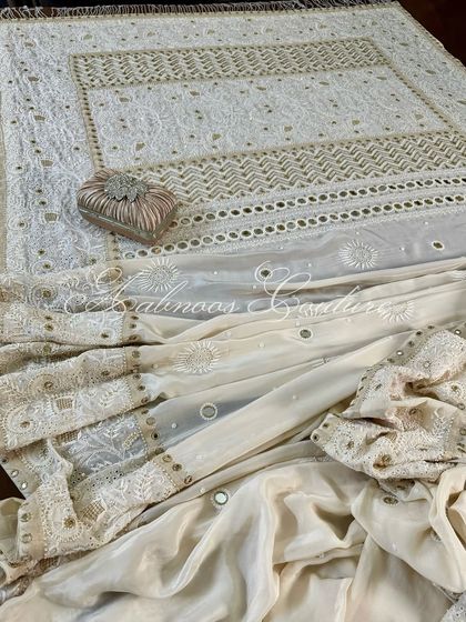 A draped view of the saree, showing the pallu and the body of the saree together.