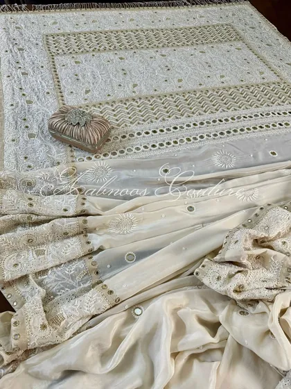 A draped view of the saree, showing the pallu and the body of the saree together.