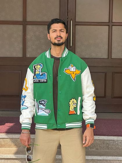 Another shot of the trendy varsity jacket, showing its details clearly.