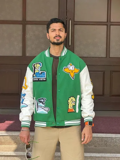 Another shot of the trendy varsity jacket, showing its details clearly.