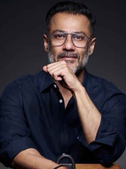 The color version of Abhishek Kapoor's portrait, showing his salt-and-pepper hair styled to perfection.