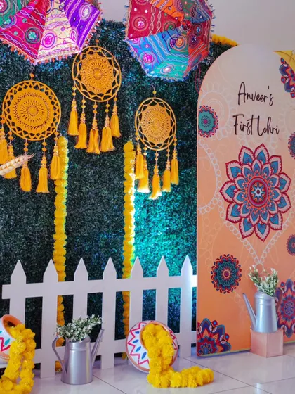I bring a modern aesthetic to traditional celebrations. For this "First Lohri" event, I blended vibrant cultural elements like phulkari-inspired umbrellas and marigolds with a clean, contemporary backdrop to honor the occasion in style.