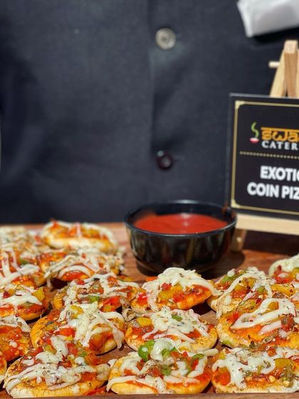 My Exotic Coin Pizzas are a fantastic mobile starter. I can customize the toppings based on your preference, offering a mini pizza experience that's easy to eat.